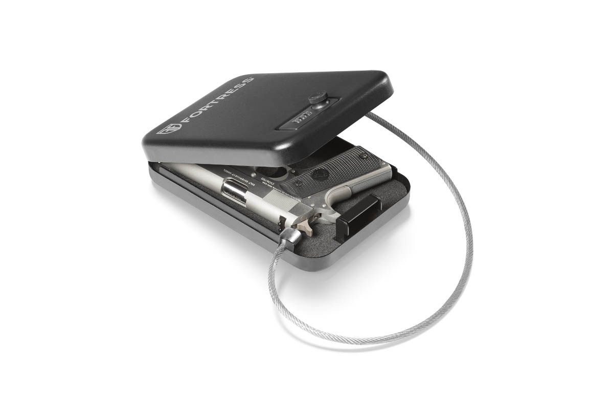 Fortress portable handgun safe with security cable and pistol stored inside