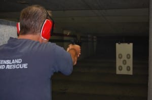 Person holding a handgun at Oklahoma's largest shooting range - H&H Shooting Sports
