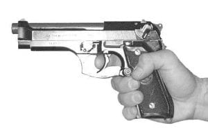 Demonstration of one-hand grip on the M9 pistol during firearms training in Oklahoma City 
