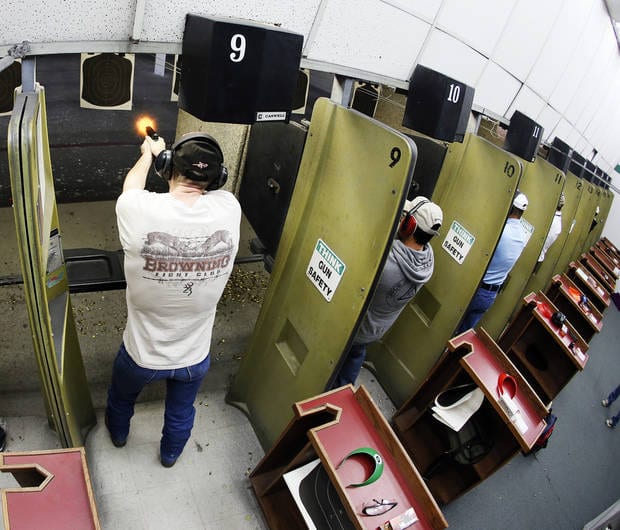 Participants fire their handguns on a gun range during a concealed-carry class at H&H Gun Range and Shooting Sports Complex in Oklahoma City, Wednesday, Jan. 23, 2013. Photo by Nate Billings, The Oklahoman