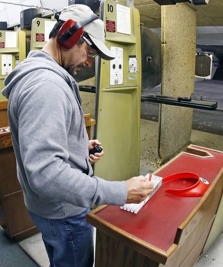 Dr. John Belardo loads a magazine for his handgun on a gun range during a concealed-carry class at H&H Gun Range and Shooting Sports Complex in Oklahoma City, Wednesday, Jan. 23, 2013. Photo by Nate Billings, The Oklahoman