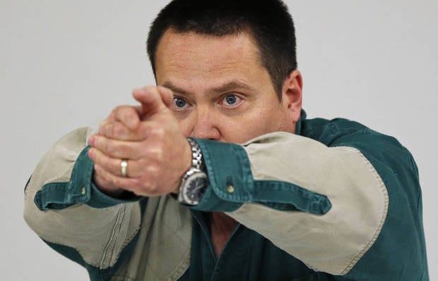 Will Andrews, training coordinator at H&H, teaches about the stance to use when firing a handgun during a concealed-carry class at H&H Gun Range and Shooting Sports Complex in Oklahoma City, Wednesday, Jan. 23, 2013. Photo by Nate Billings, The Oklahoman