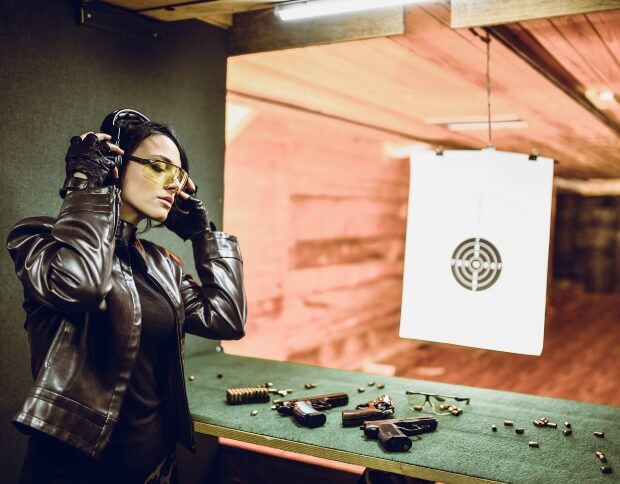 Female shooter aiming at the indoor range in Oklahoma City